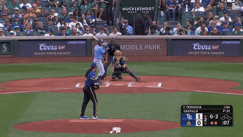 A Baseball Game Is Being Played In Front Of A Coors Sign GIF