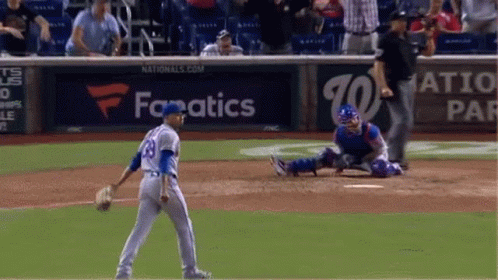 A Baseball Game Is Being Played In Front Of A Fanatics Sign GIF