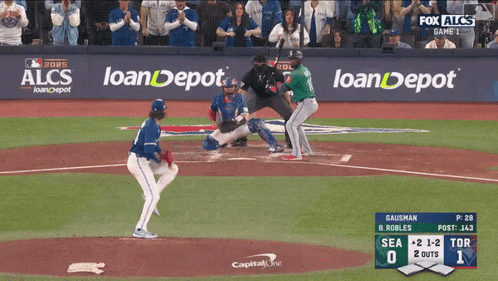 A Baseball Game Is Being Played In Front Of A Fox Alcs Banner GIF