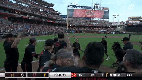 A Baseball Game Is Being Played In Front Of A Large Screen That Says Great American On It GIF