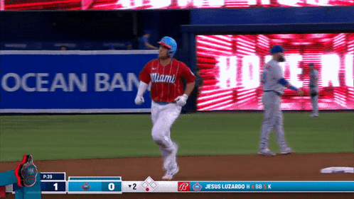 A Baseball Game Is Being Played In Front Of A Miami Banner GIF