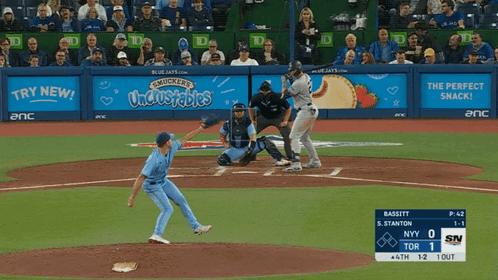 A Baseball Game Is Being Played In Front Of A Mucker 'S Uncrustables Banner GIF