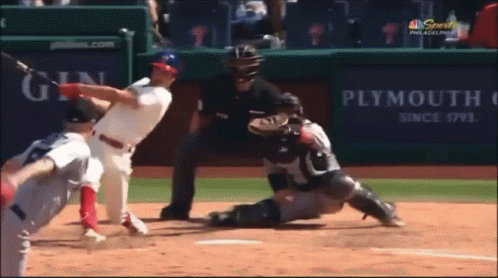 A Baseball Game Is Being Played In Front Of A Plymouth Advertisement GIF