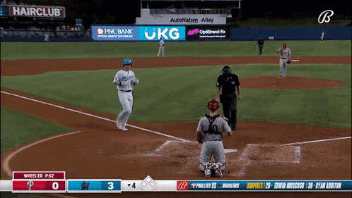 A Baseball Game Is Being Played In Front Of A Pnc Bank Sign GIF