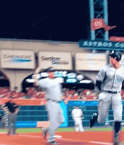 A Baseball Game Is Being Played In Front Of A Sign That Says Astros On It GIF