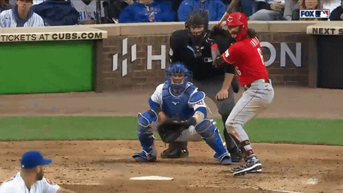 A Baseball Game Is Being Played In Front Of A Sign That Says Cubs.com GIF
