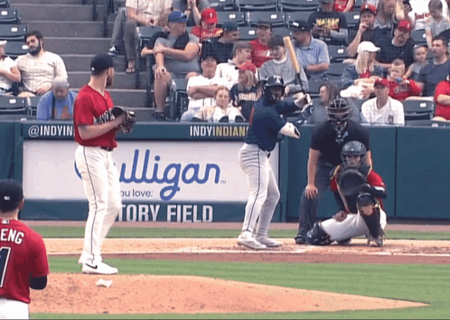 a baseball game is being played in front of a sign that says indy indians