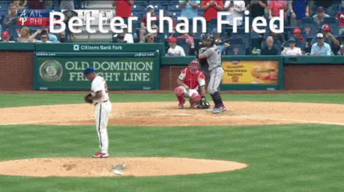 A Baseball Game Is Being Played In Front Of A Sign That Says Old Dominion Freight Line GIF