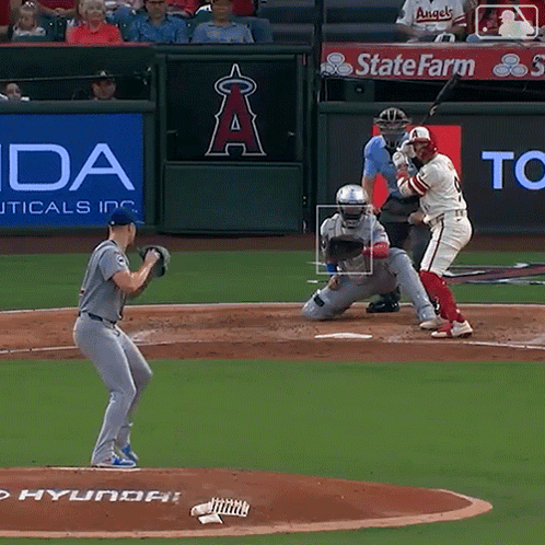 a baseball game is being played in front of a sign that says state farm