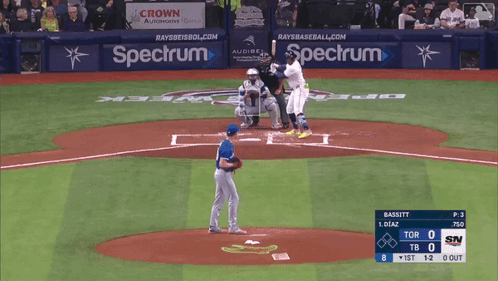 A Baseball Game Is Being Played In Front Of A Spectrum Ad GIF