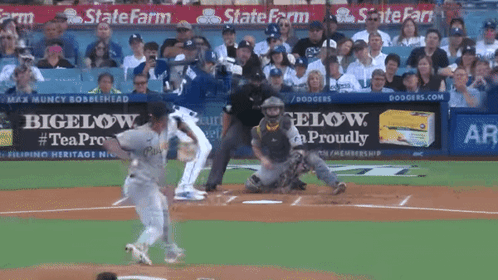 A Baseball Game Is Being Played In Front Of A State Farm Sign GIF