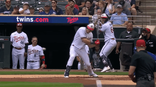 A Baseball Game Is Being Played In Front Of A Twins Advertisement GIF