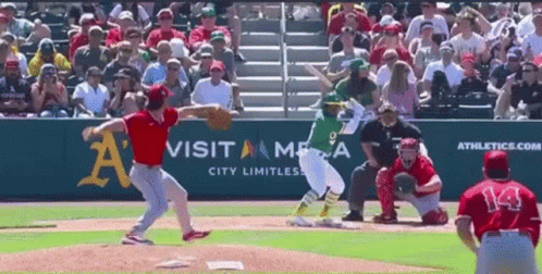 A Baseball Game Is Being Played In Front Of A Visit America Advertisement GIF
