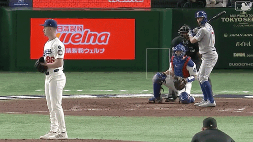 A Baseball Game Is Being Played In Front Of A Welna Sign GIF