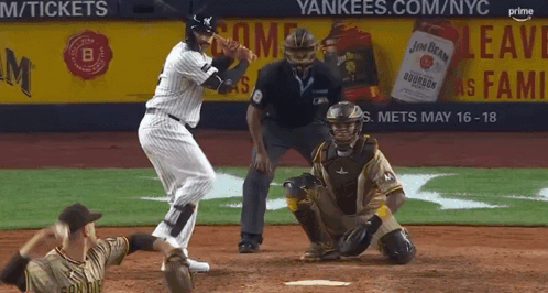 A Baseball Game Is Being Played In Front Of A Yankees Advertisement GIF