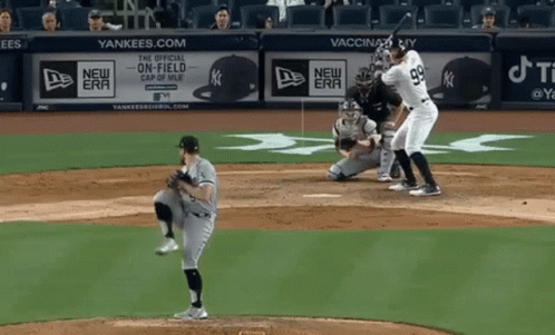 A Baseball Game Is Being Played In Front Of A Yankees Advertisement GIF