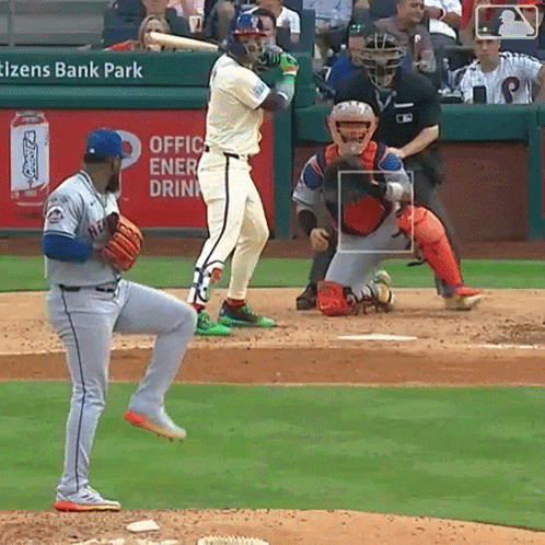 A Baseball Game Is Being Played In Front Of An Ad For Coca Cola GIF