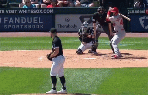 A Baseball Game Is Being Played In Front Of An Ad For Fanduel Sportsbook GIF