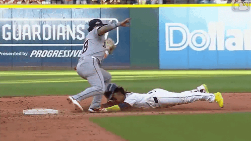 a baseball game is being played in front of an advertisement for dollar general