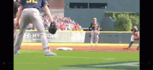 A Baseball Game Is Being Played On A Field With A Hyundai Ad On The Wall . GIF