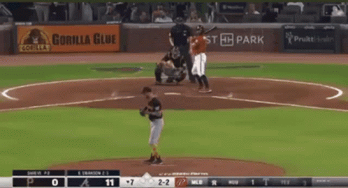 A Baseball Game Is Being Played With A Gorilla Glue Ad In The Background GIF