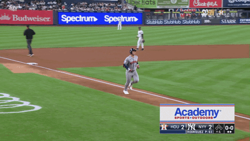 a baseball game is being played with a spectrum ad in the outfield