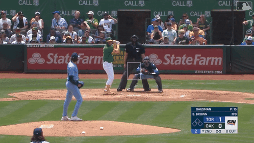 A Baseball Game Is Being Played With A State Farm Ad In The Outfield GIF
