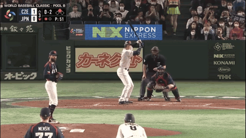 A Baseball Game Is Being Played With An Ad For Nex Express GIF