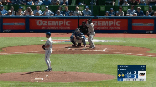 A Baseball Game Is Being Played With An Ad For Zempic GIF