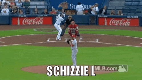 A Baseball Game Is Being Played With Coca-Cola Advertisements In The Outfield GIF