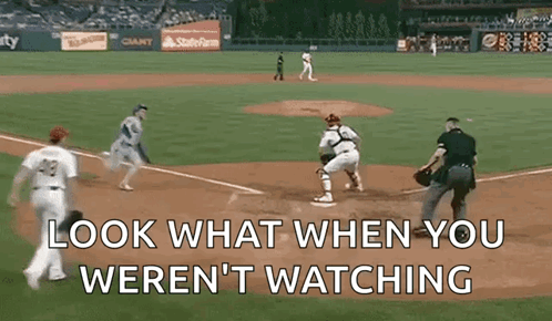 A Baseball Game With The Words Look What When You Weren T Watching GIF