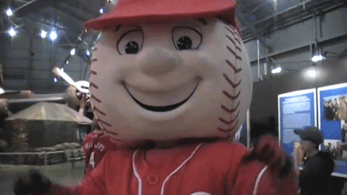 A Baseball Mascot With The Number 4 On The Back Of His Shirt GIF