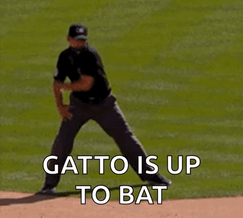 A Baseball Pitcher Is Getting Ready To Throw The Ball And The Words " Gatto Is Up To Bat " Are Visible GIF