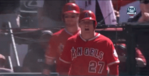 A Baseball Player For The Angels Is Standing In Front Of A Sign That Says Old Service GIF