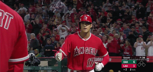A Baseball Player For The Angels Runs Towards The Dugout GIF