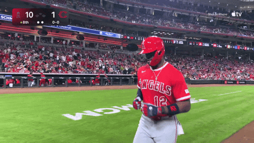 A Baseball Player For The Angels Stands On The Field During A Game GIF