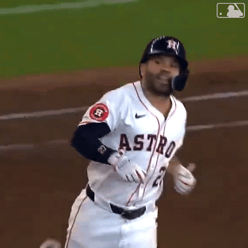 A Baseball Player For The Astros Is Running Across The Field GIF