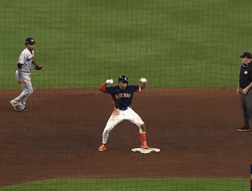 A Baseball Player For The Astros Is Standing On The Base GIF