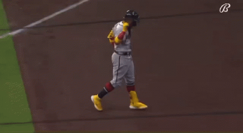 A Baseball Player For The Atlanta Braves Is Pointing Up GIF