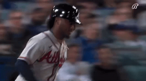 A Baseball Player For The Atlanta Braves Is Running GIF
