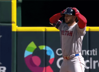 A Baseball Player For The Boston Red Sox Stands On The Field GIF