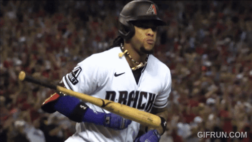 A Baseball Player For The Colorado Rockies Holds His Bat GIF
