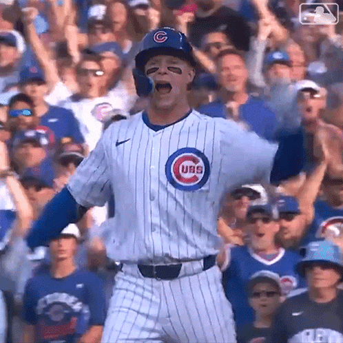 A Baseball Player For The Cubs Is Standing In Front Of A Crowd GIF