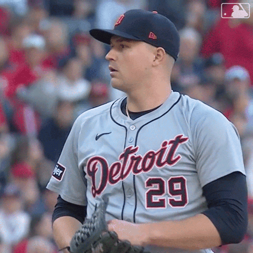 A Baseball Player For The Detroit Tigers Holds His Glove GIF