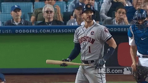A Baseball Player For The Houston Astros Holds A Bat GIF