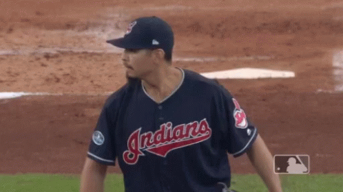 A Baseball Player For The Indians Is Getting Ready To Throw The Ball GIF