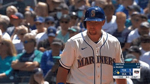 A Baseball Player For The Mariners Stands In Front Of A Crowd Of People GIF