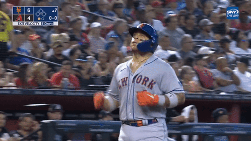 A Baseball Player For The New York Mets Is Running Towards The Fence GIF