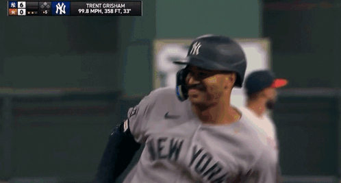 A Baseball Player For The New York Yankees Is Running Towards Home Plate GIF
