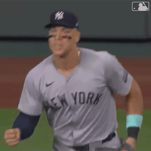 A Baseball Player For The New York Yankees Is Throwing A Ball GIF